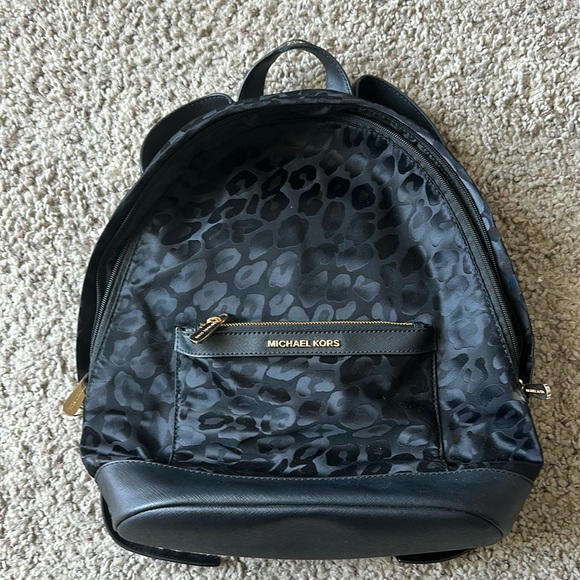 MICHAEL Michael Kors Handbags - Used Michael Kors black canvas backpack. Black with black leopard spots.